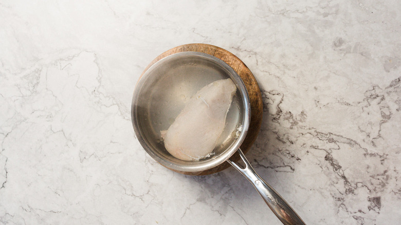 Cooked chicken in saucepan