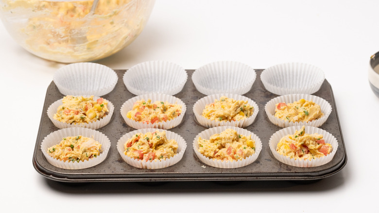 Unbaked crab muffins in liners