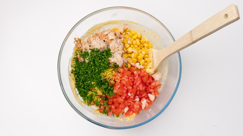 Bowl with herbs, tomatoes, corn, crab meat