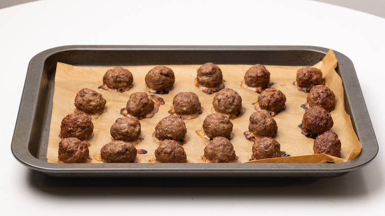 baked meatballs on baking sheet