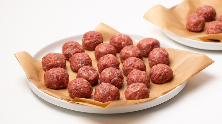 raw meatballs on a plate