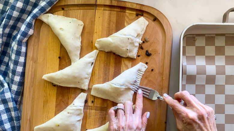 pressing pastry with fork