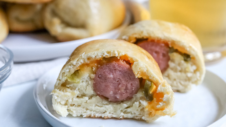 halved sausage kolache on plate