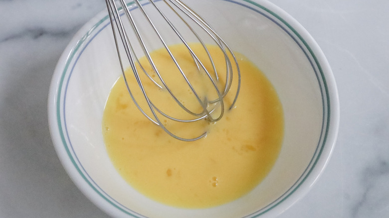 egg wash and whisk in bowl