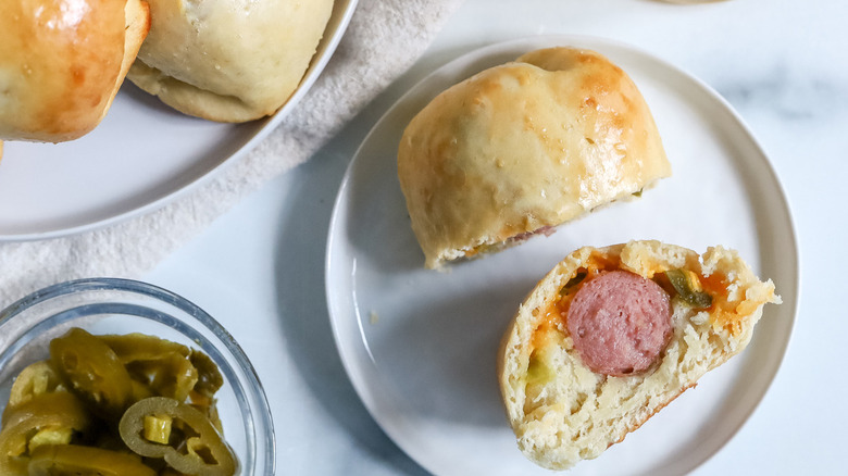 halved sausage kolache on plate