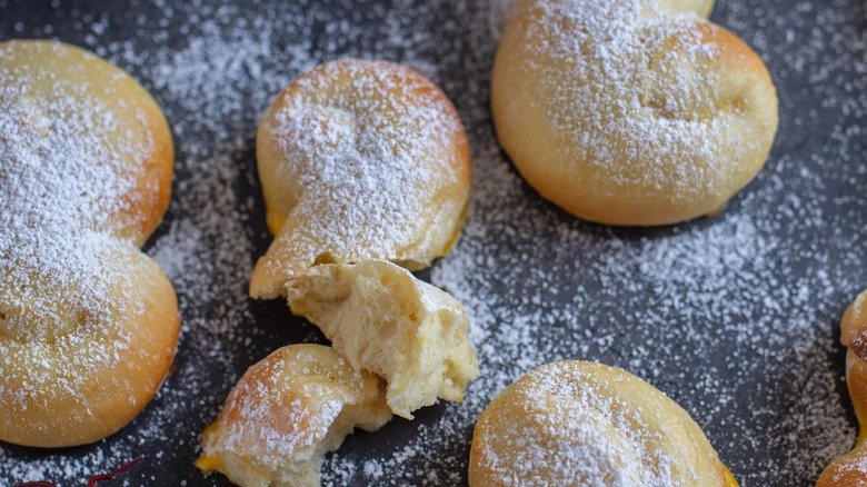 Lussekatter buns on baking sheet