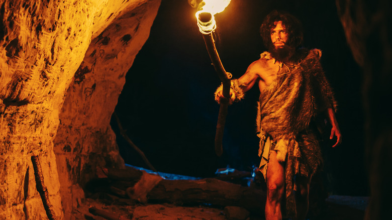 caveman with torch