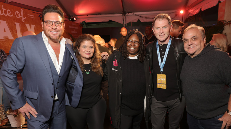 Scott Conant, Alex Guarnaschelli, Bobby Flay, and Whoopi Goldberg smiling