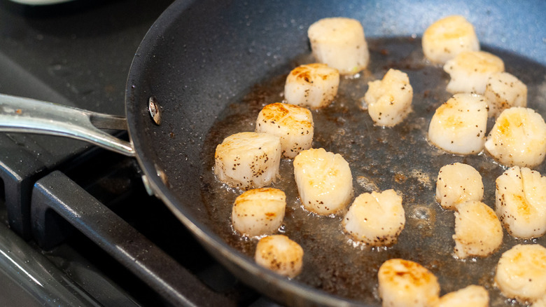 cooked scallops in frying pan