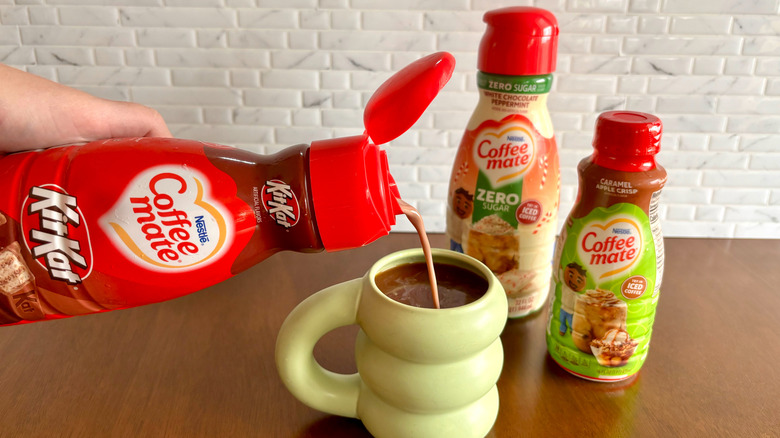 coffee creamer pouring into cup