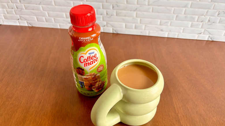 Coffee-Mate creamer and coffee cup