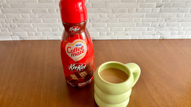 Coffee-Mate creamer and coffee cup