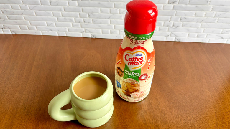 Coffee-Mate creamer and coffee cup