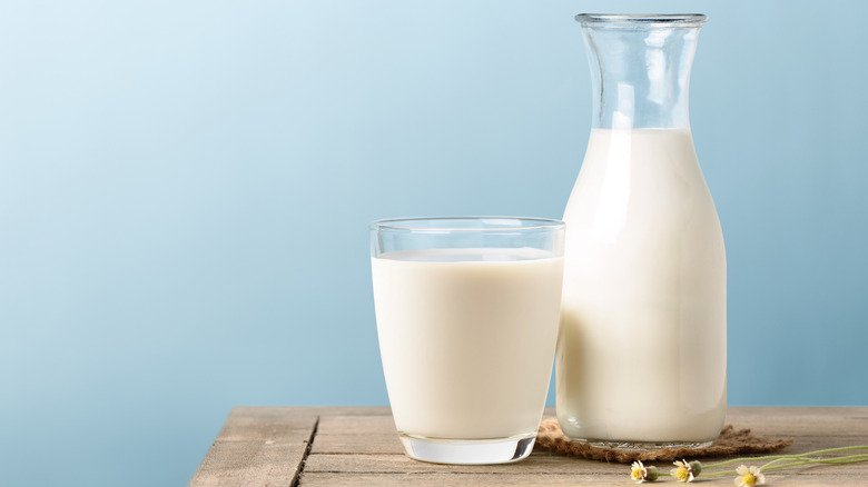 Pitcher and glass filled with dairy