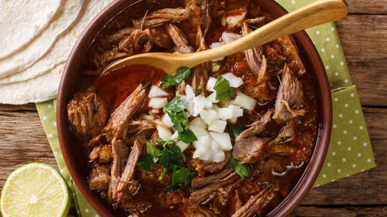 Bowl of birria with onions