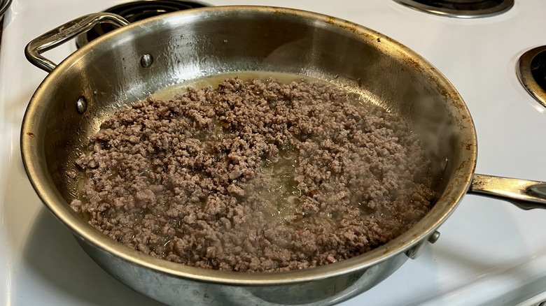 ground beef cooking in skillet