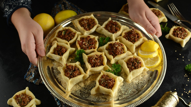 Sfeeha on platter with lemon