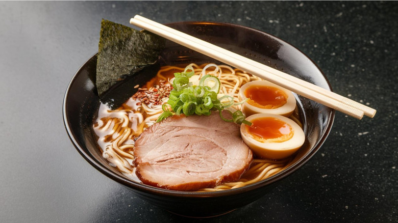 Bowl of ramen noodles with egg, meat