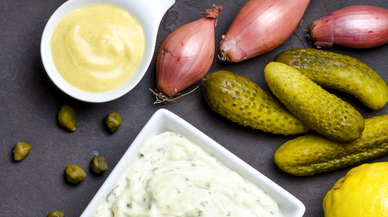 white cream sauce surrounded by raw ingredients