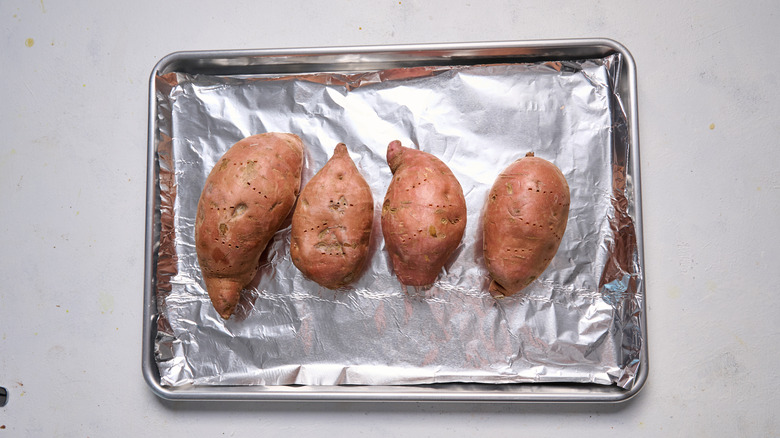 sweet potatoes on baking sheet