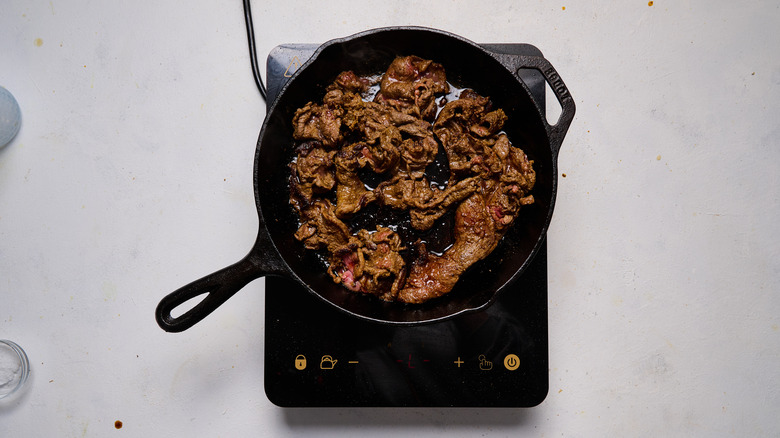 cooking beef in skillet