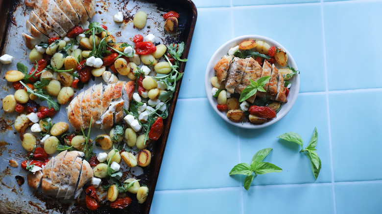 Tray drizzled with balsamic vinegar, plate of chicken