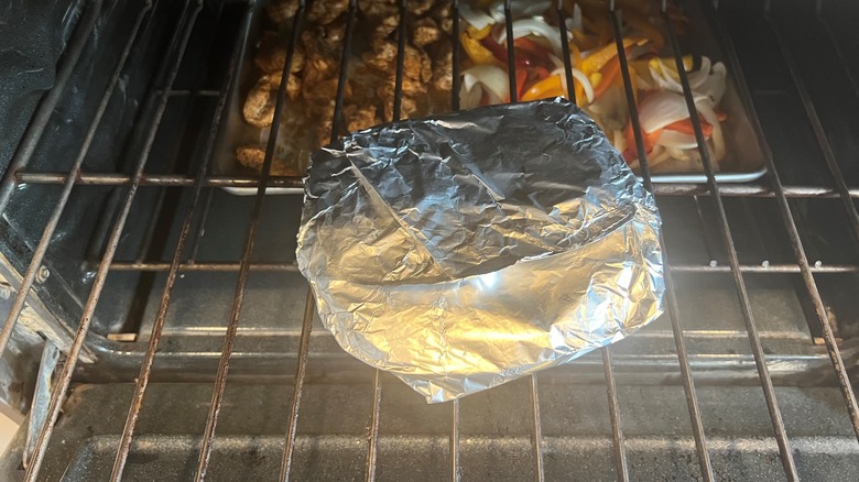 foil wrapped package in oven