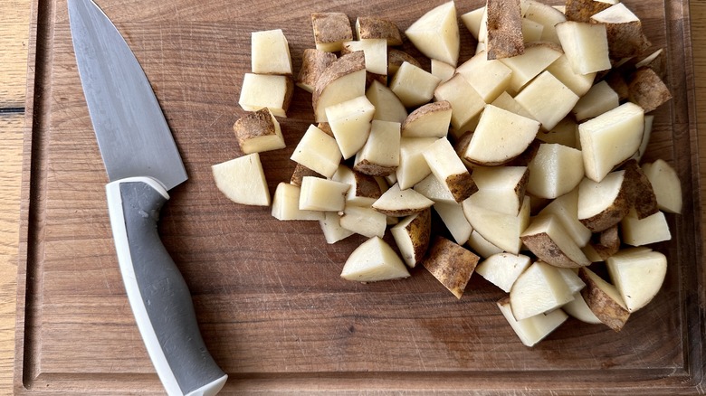 chopped raw potatoes with knife