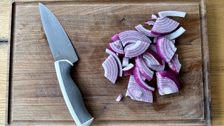 chopped raw onions with knife