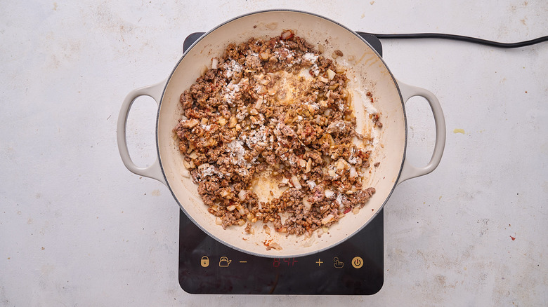 stirring flour into beef mixture