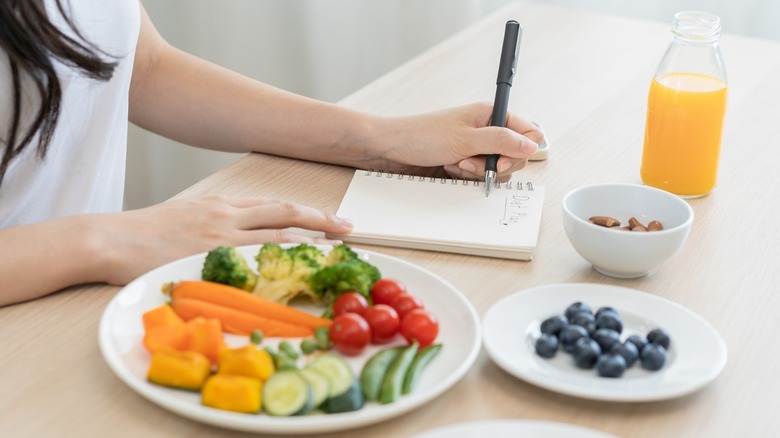 Nutritionist taking notes