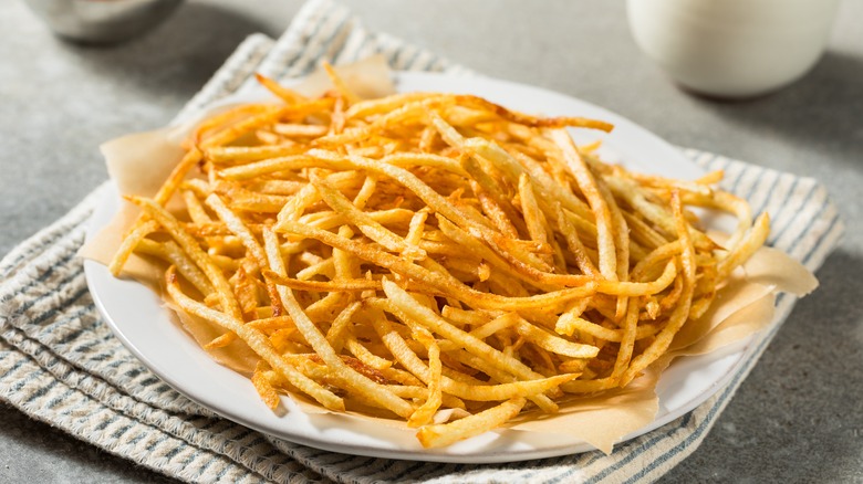 Pile of shoestring fries on plate 