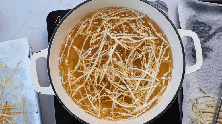 frying french fries in pot