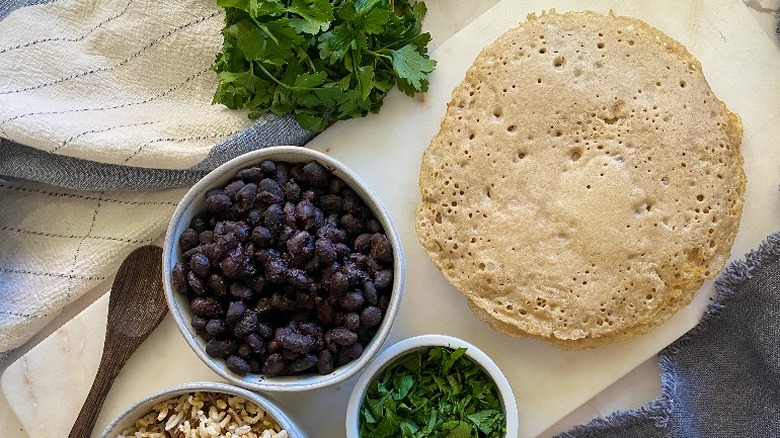 injera on platter with beans