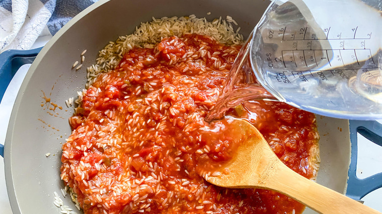 cooking the rice with salsa