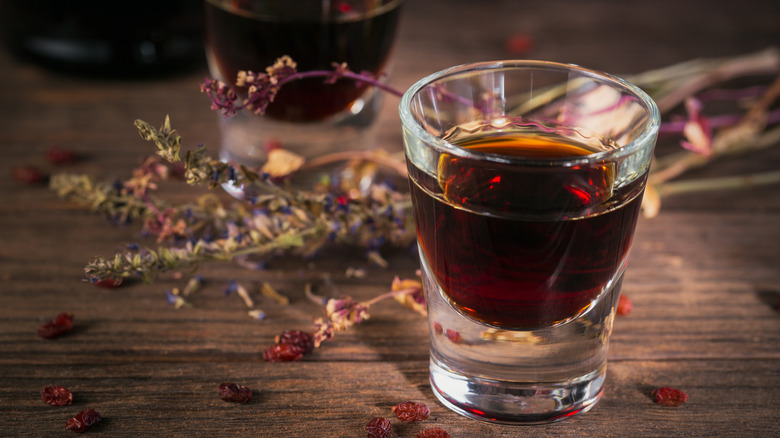 dark brown liquor in shot glass