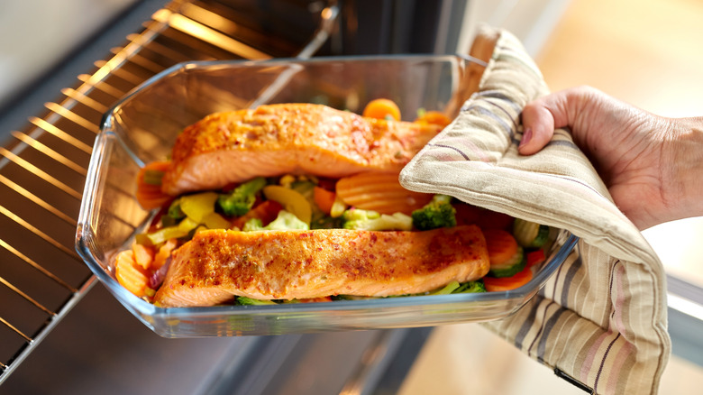 Uncovered baked salmon in oven 