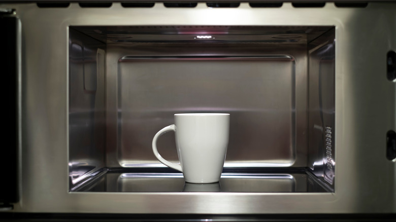 A cup inside a microwave.