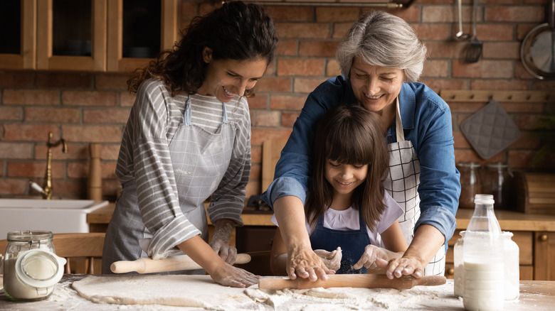 Three generations of women baking