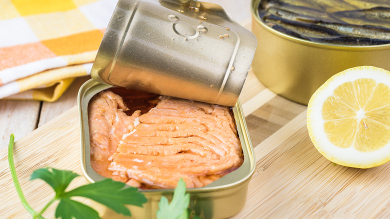 canned salmon on wooden board