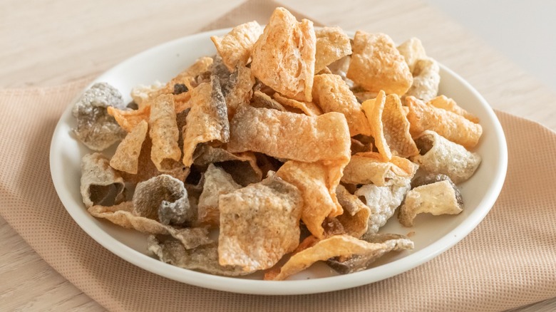 A plate of crispy fried salmon skin