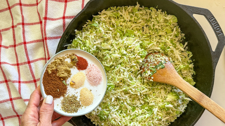 adding spices to skillet