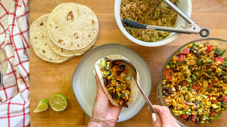 hand filling taco shell