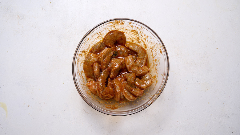 marinating shrimp in bowl