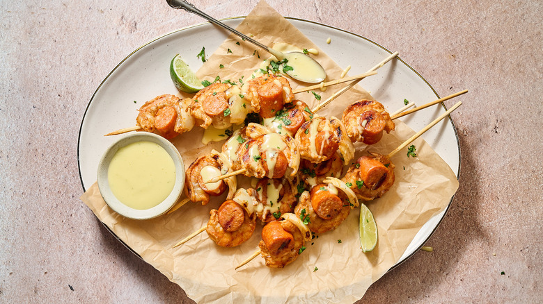 shrimp skewers and aioli on plate