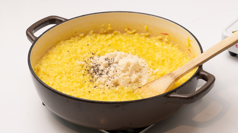 mixing Parmesan into risotto