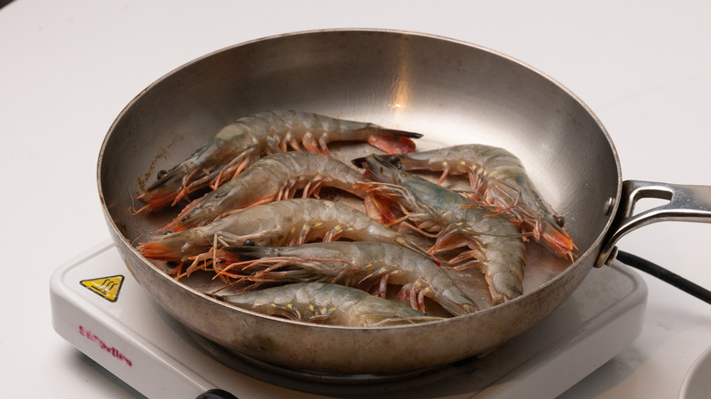 frying shrimp in a pan