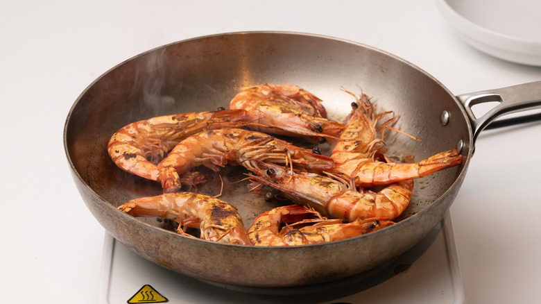 frying shrimp in a pan