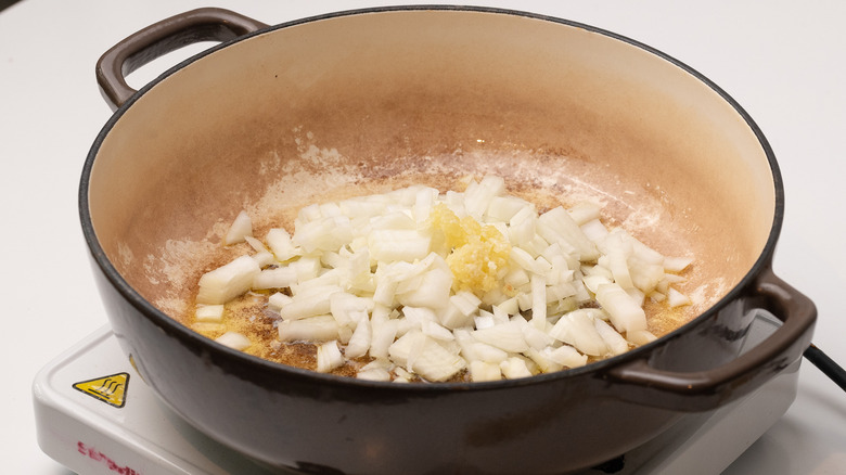 sauteing onion and garlic in pan