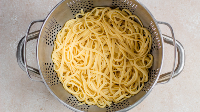 linguine draining in collander